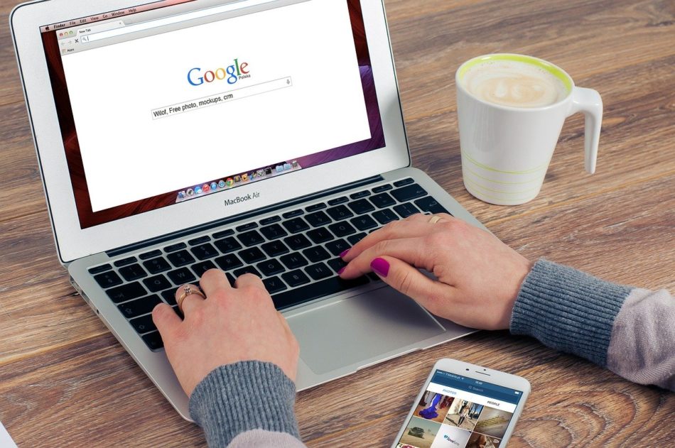 Laptop with Google search open on a desk